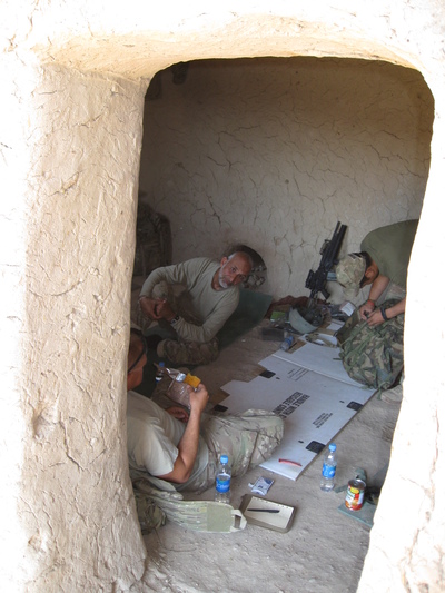 Relaxing in a fox hole during a mission.